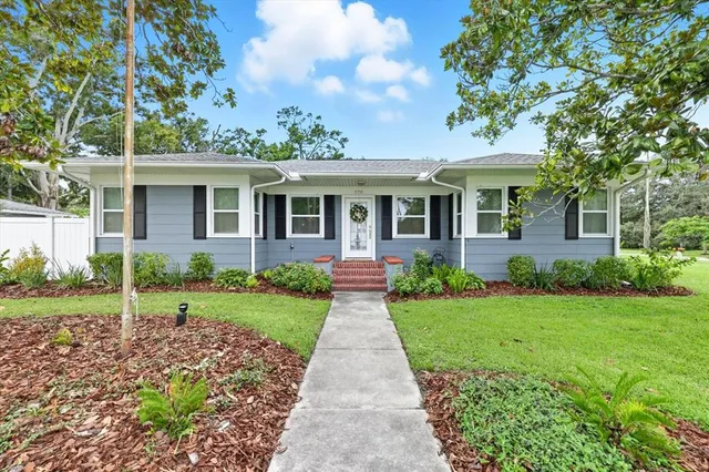 a front view of a house with garden