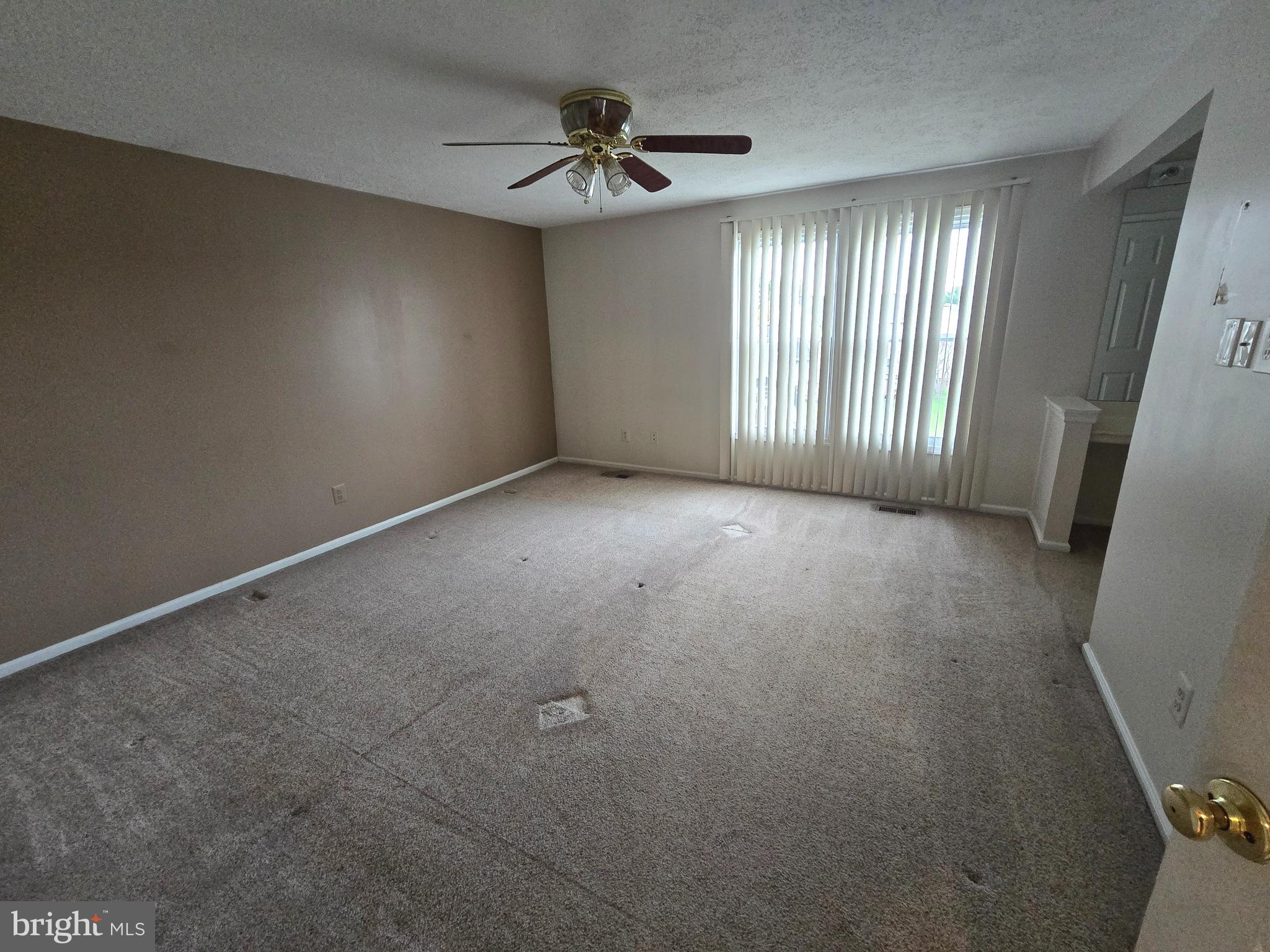 9503 Hallhurst Road Nottingham, MD 21236 - Photo 8 of 17 a view of an empty room with a window