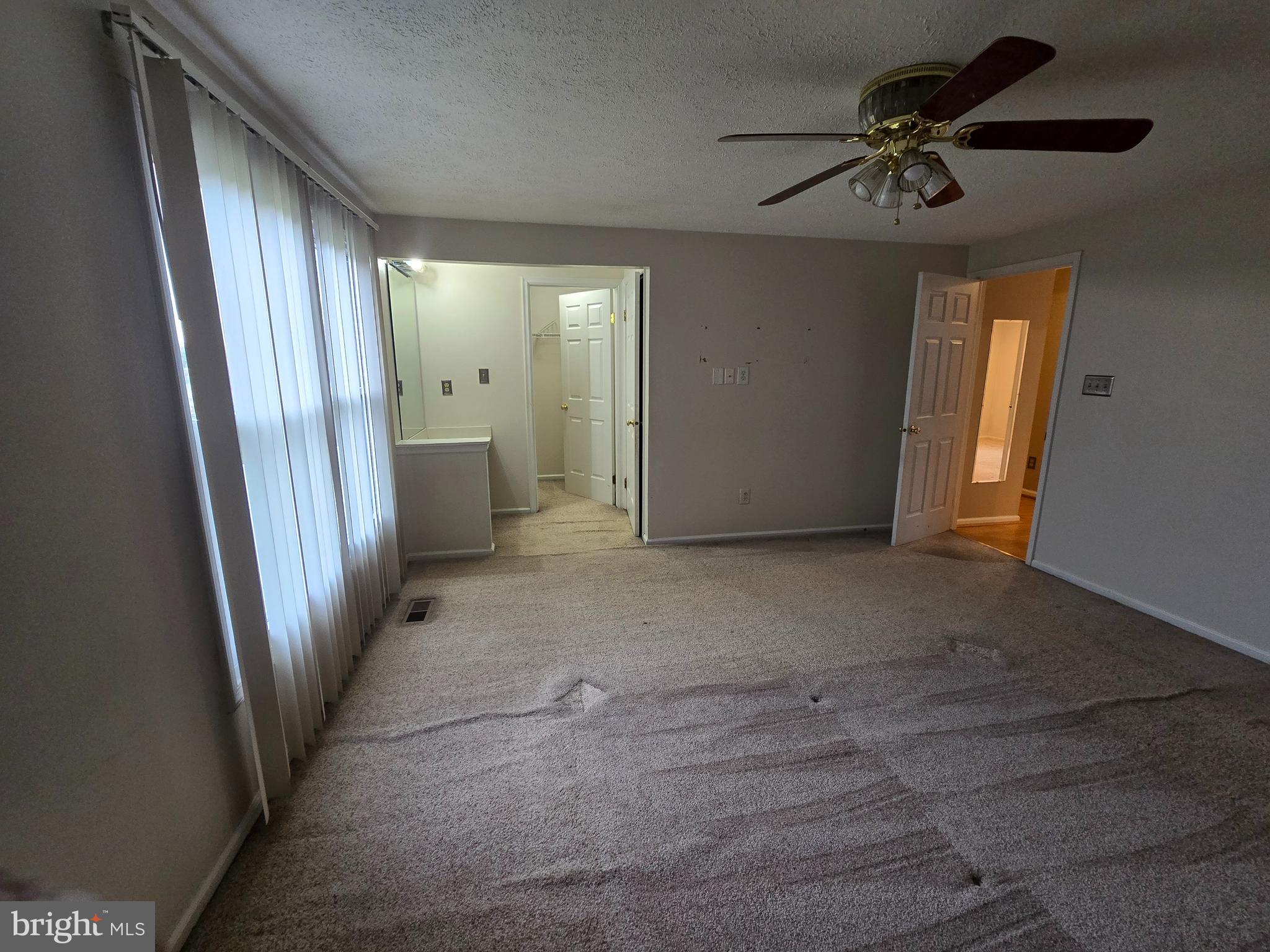 9503 Hallhurst Road Nottingham, MD 21236 - Photo 9 of 17 wooden floor in an empty room with a window