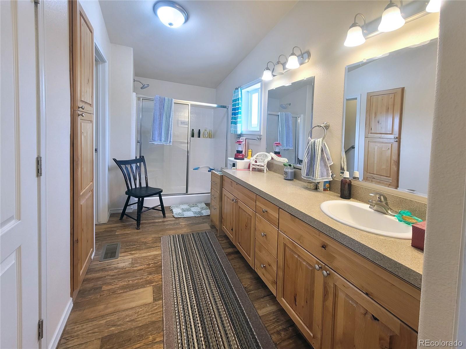 2252 White Tail Road, Unit 2 San Luis, CO 81152 - Photo 16 of 44 a bathroom with a sink and a mirror