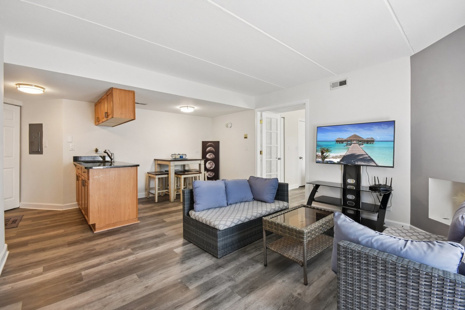 1751 South Washington Street, Unit 1 Naperville, IL 60565 - Photo 3 of 16 a living room with furniture and wooden floor