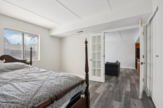 a bedroom with a bed and a dresser