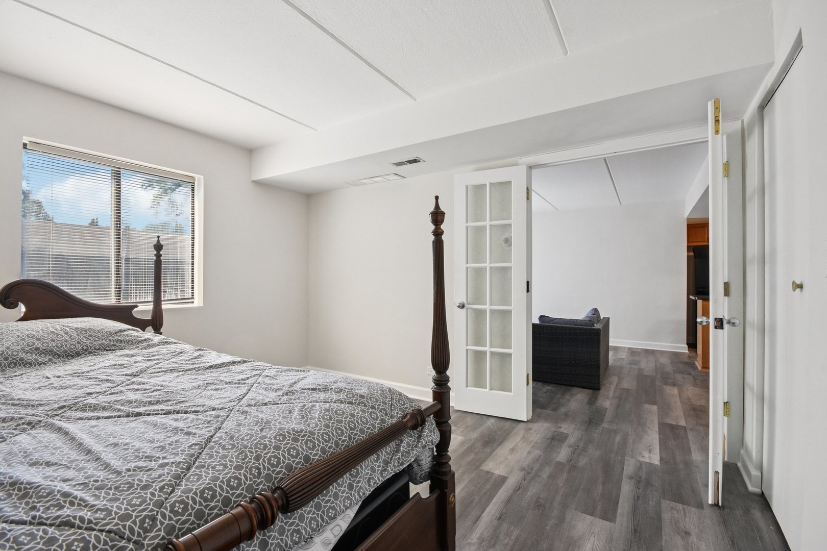 1751 South Washington Street, Unit 1 Naperville, IL 60565 - Photo 10 of 16 a bedroom with a bed and a dresser