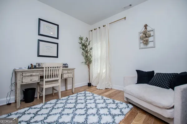 a bedroom with furniture and a fireplace