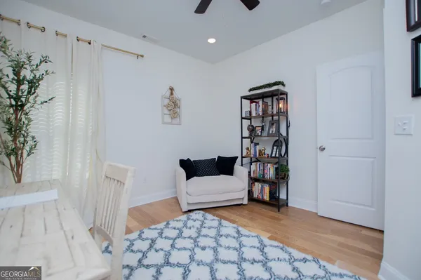 a living room with furniture and a rug
