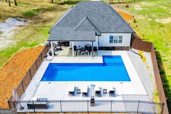 a view of a house with wooden deck and living room