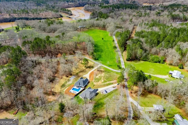 an aerial view of residential house with outdoor space