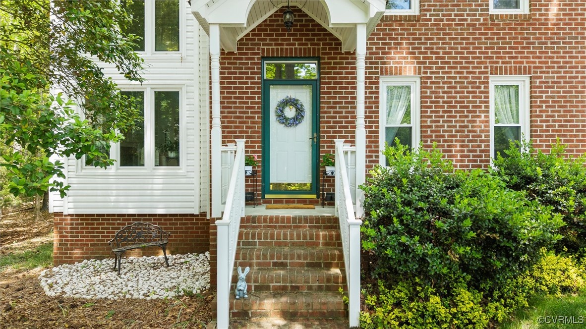6000 Lansgate Road Midlothian, VA 23112 - Photo 2 of 49 a view of a brick house with large windows