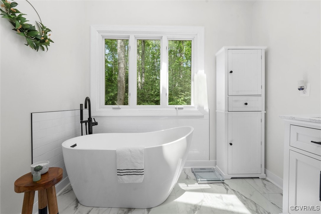 6000 Lansgate Road Midlothian, VA 23112 - Photo 24 of 49 a white bath tub sitting in a bathroom