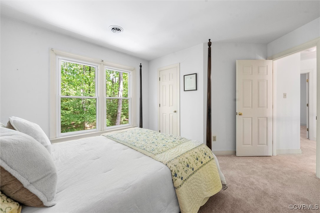 6000 Lansgate Road Midlothian, VA 23112 - Photo 29 of 49 a spacious bedroom with a bed and a window