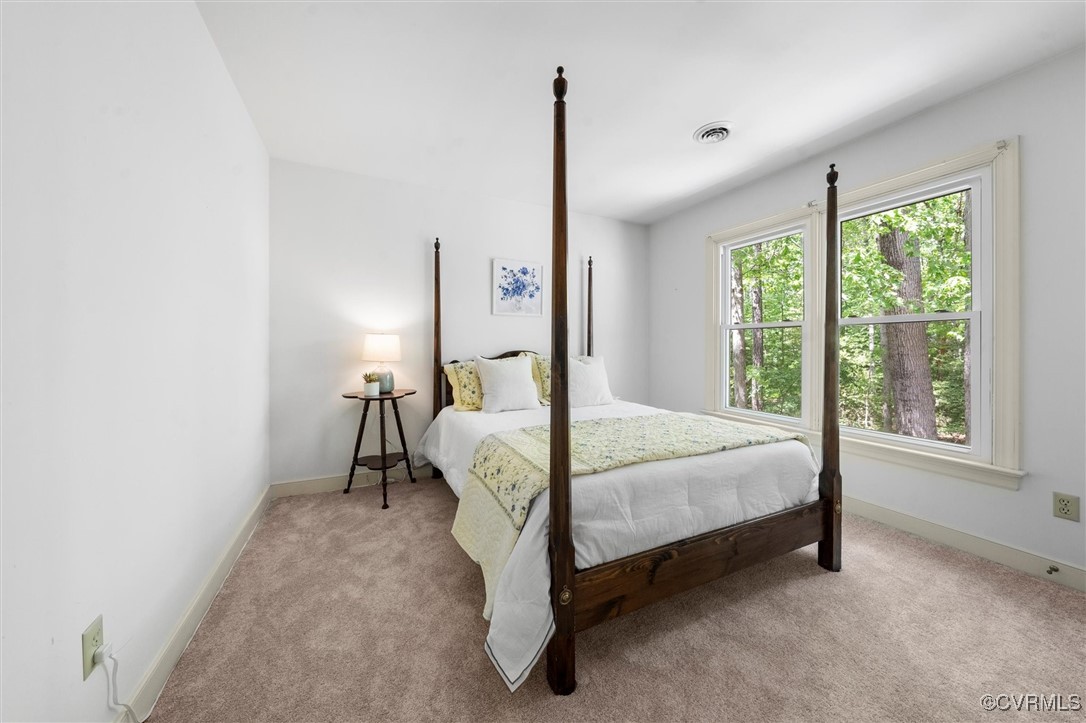 6000 Lansgate Road Midlothian, VA 23112 - Photo 30 of 49 a bed sitting in a spacious bedroom next to a window