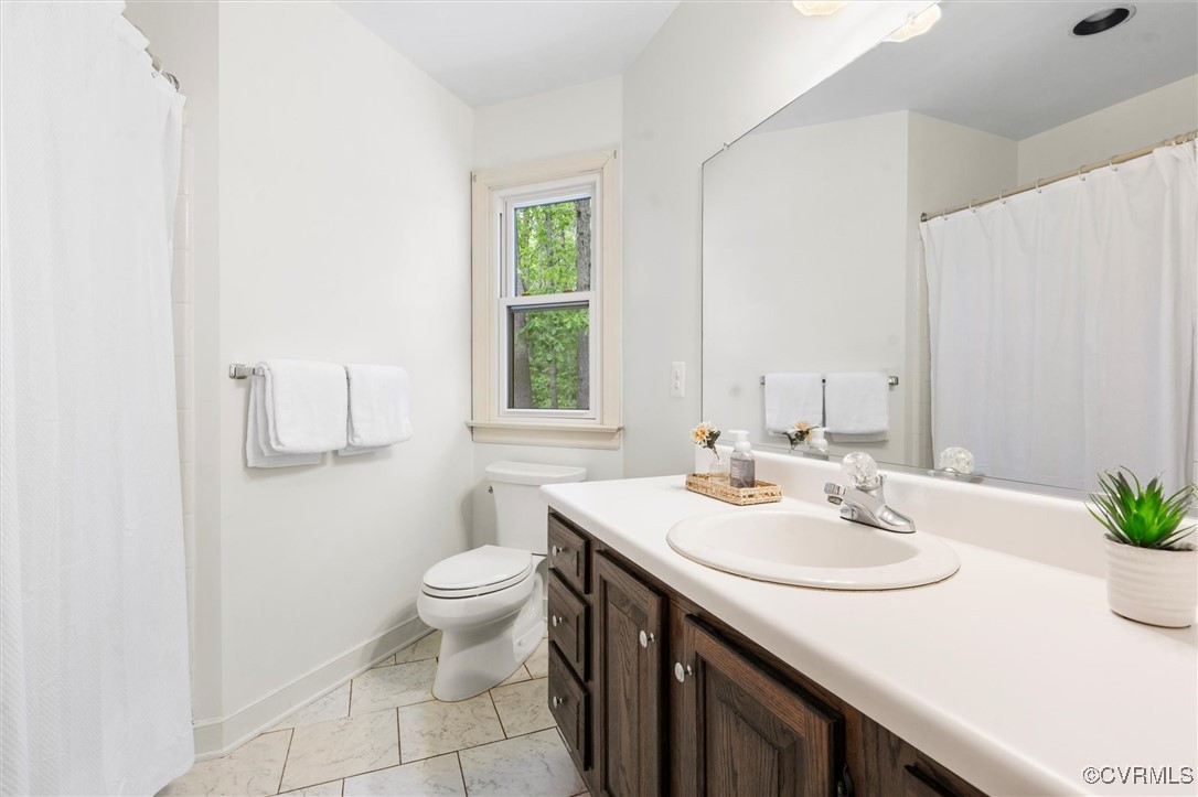 6000 Lansgate Road Midlothian, VA 23112 - Photo 34 of 49 a bathroom with a sink and a toilet