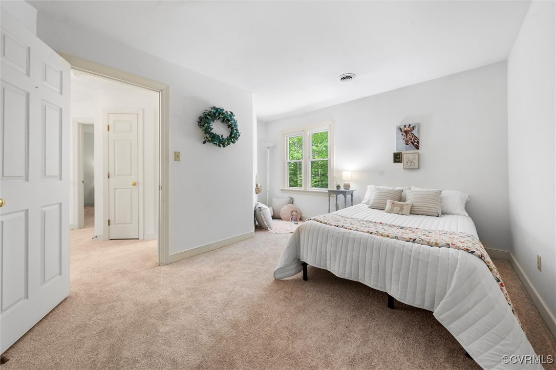 6000 Lansgate Road Midlothian, VA 23112 - Photo 35 of 49 a spacious bedroom with a bed and a window
