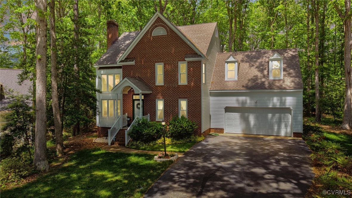 6000 Lansgate Road Midlothian, VA 23112 - Photo 47 of 49 a front view of a house with a yard and garage