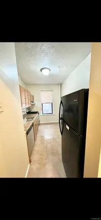 a view of kitchen island with cabinets