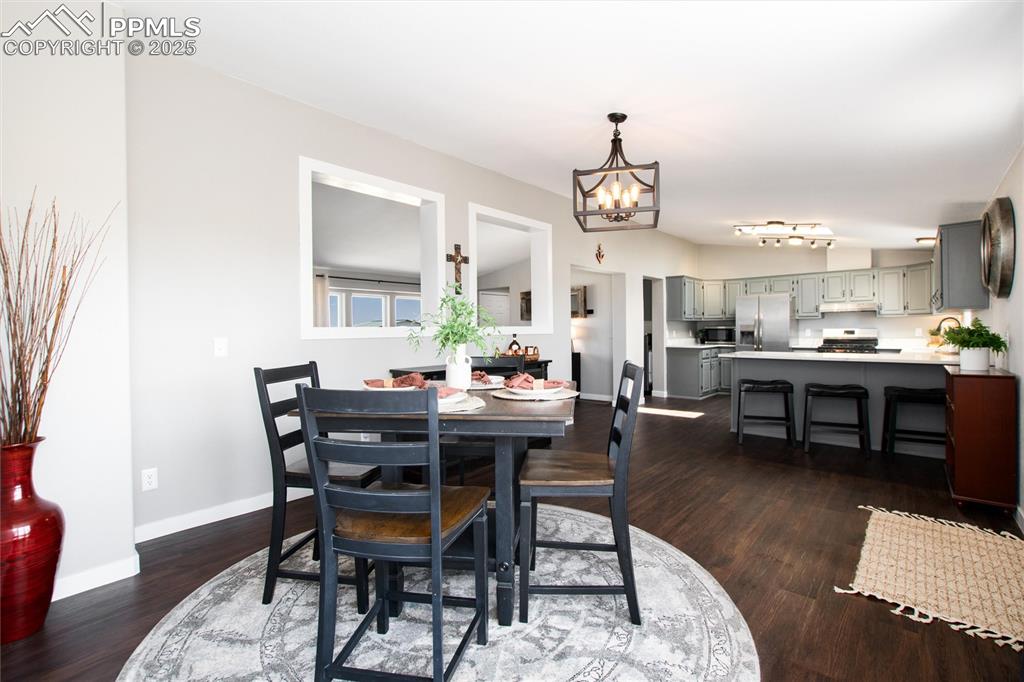 11100 Haskel Creek Road Larkspur, CO 80118 - Photo 15 of 49 a view of a dining room with furniture