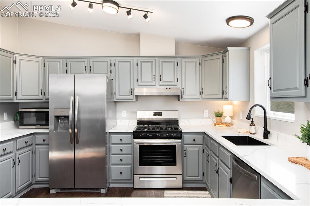 11100 Haskel Creek Road Larkspur, CO 80118 - Photo 18 of 49 a kitchen with cabinets stainless steel appliances and counter space