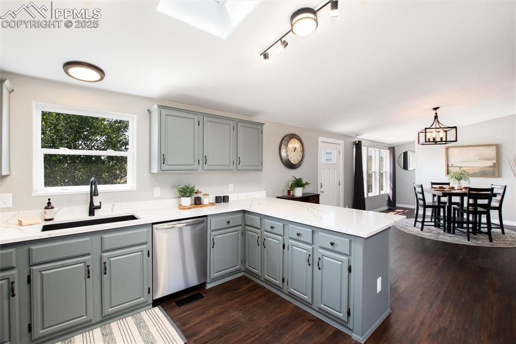 11100 Haskel Creek Road Larkspur, CO 80118 - Photo 20 of 49 a kitchen with a sink window and cabinets