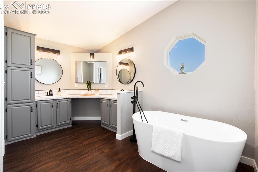 11100 Haskel Creek Road Larkspur, CO 80118 - Photo 28 of 49 a bathroom with a sink and mirror