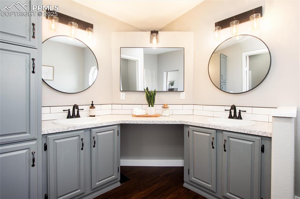 11100 Haskel Creek Road Larkspur, CO 80118 - Photo 29 of 49 a bathroom with a double vanity sink and a mirror