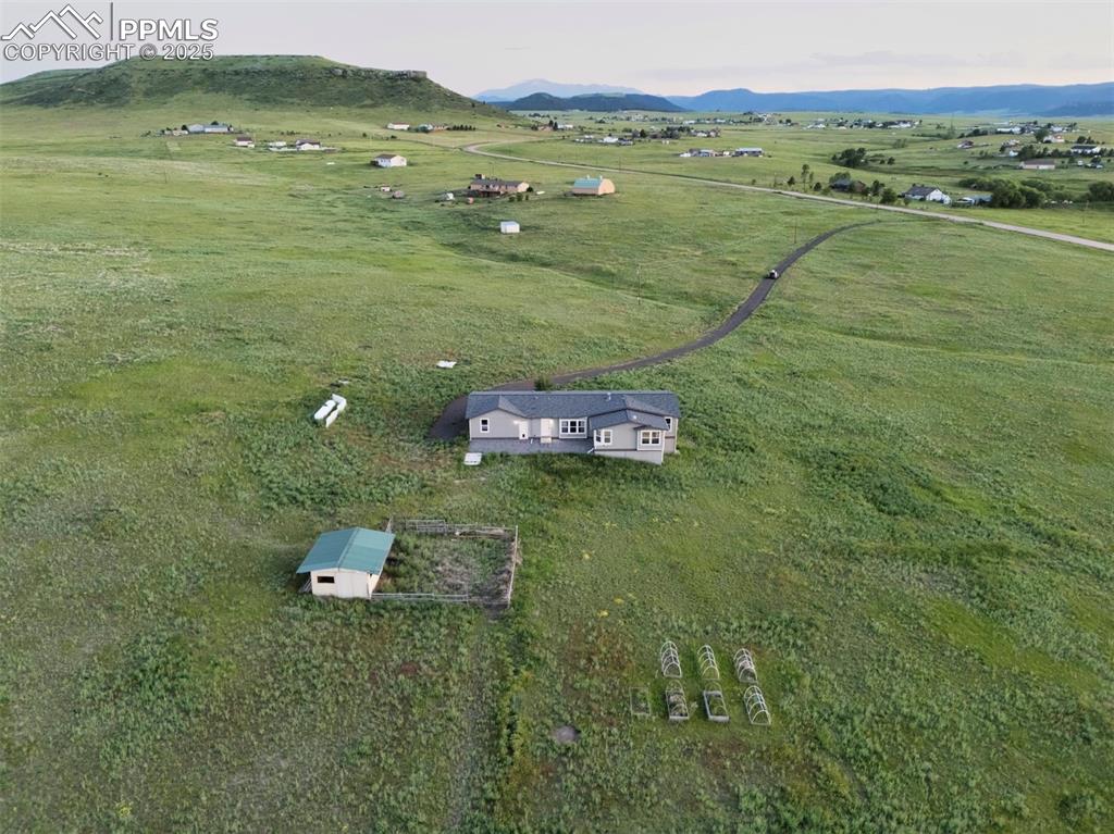11100 Haskel Creek Road Larkspur, CO 80118 - Photo 3 of 49 a view of a field with an ocean
