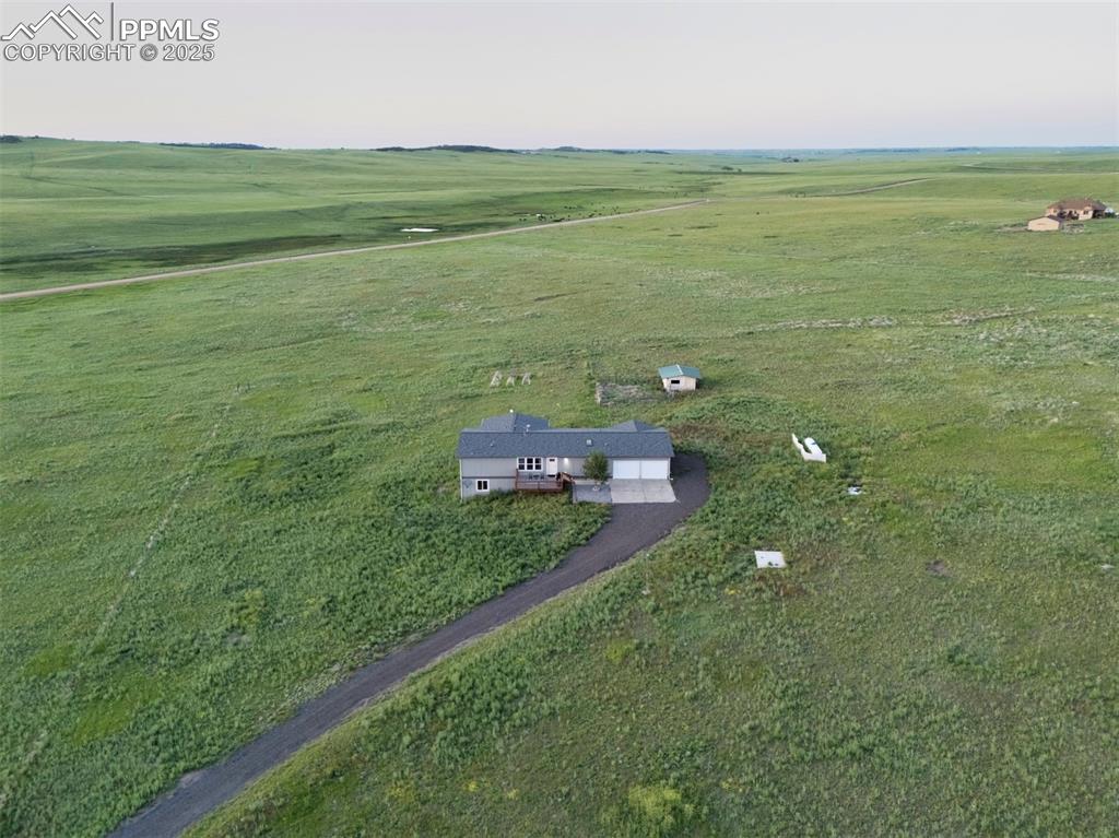 11100 Haskel Creek Road Larkspur, CO 80118 - Photo 4 of 49 a view of a field with an ocean