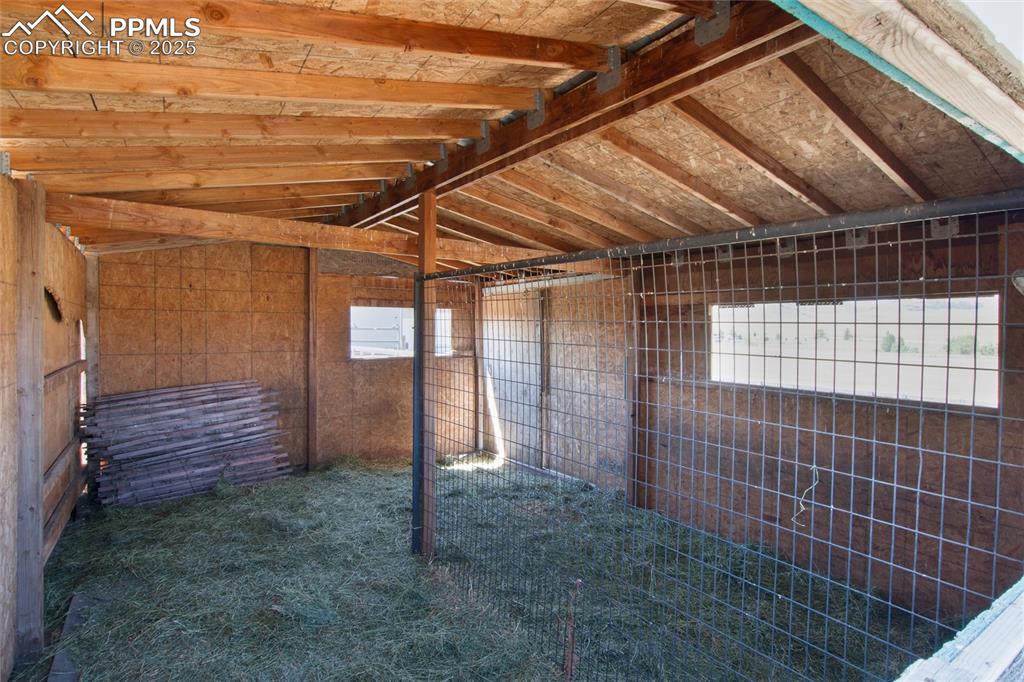 11100 Haskel Creek Road Larkspur, CO 80118 - Photo 42 of 49 a view of a room with wooden walls