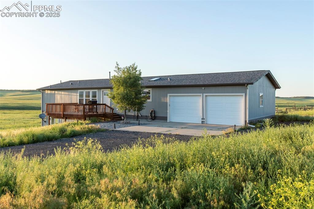 11100 Haskel Creek Road Larkspur, CO 80118 - Photo 46 of 49 a front view of a house with a yard