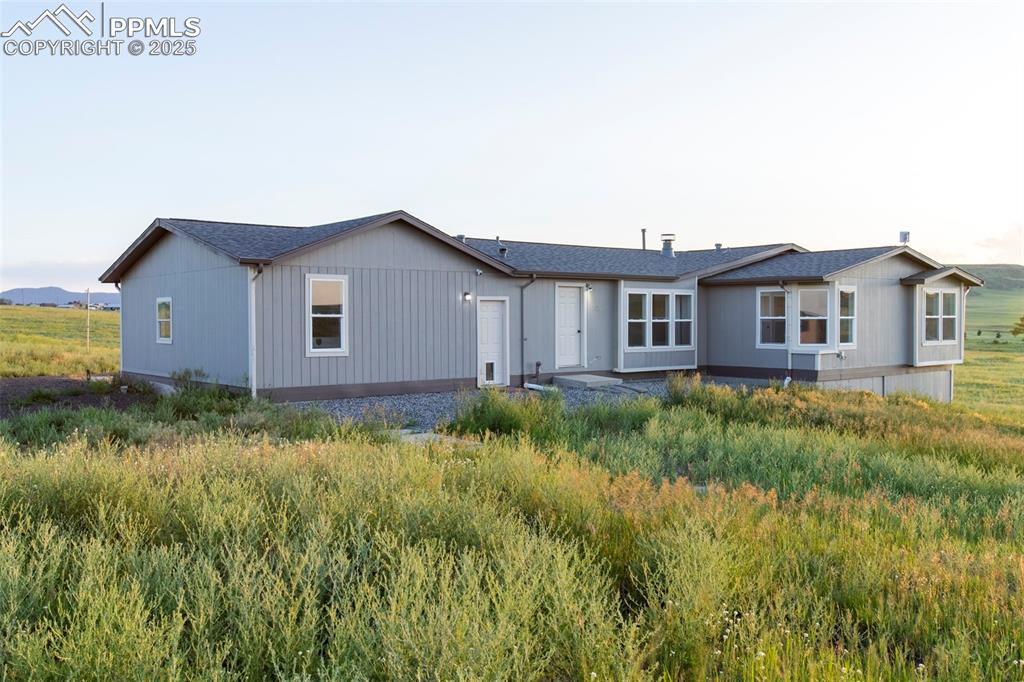 11100 Haskel Creek Road Larkspur, CO 80118 - Photo 47 of 49 a view of a house with a yard