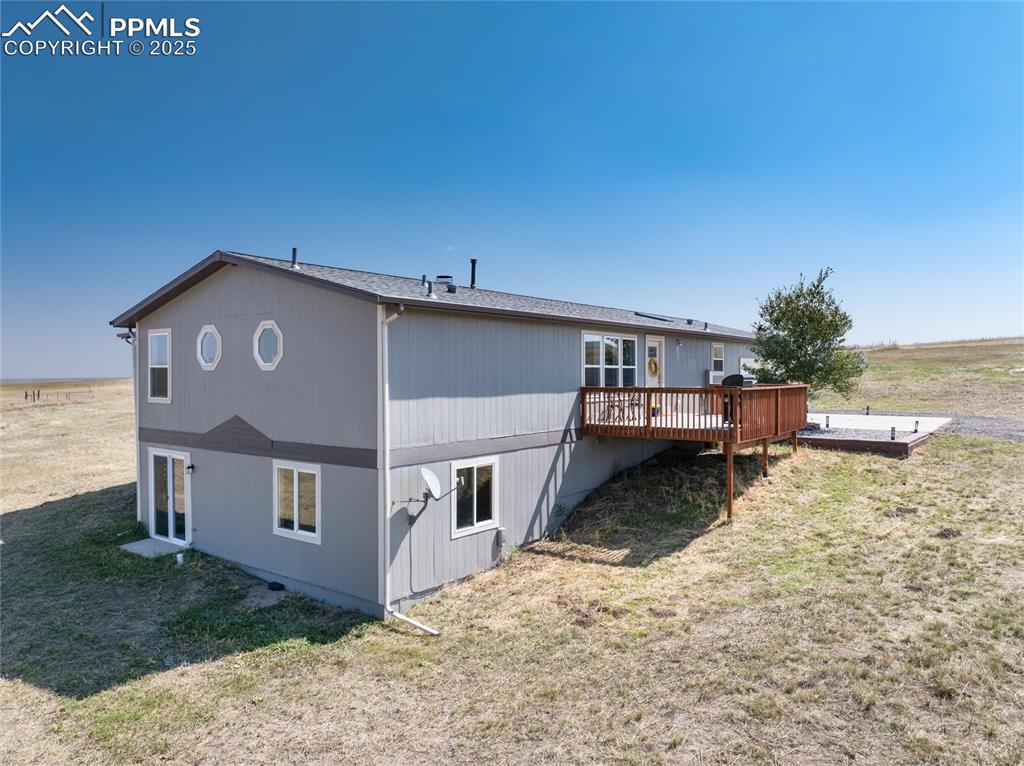 11100 Haskel Creek Road Larkspur, CO 80118 - Photo 6 of 49 a view of a house with a yard