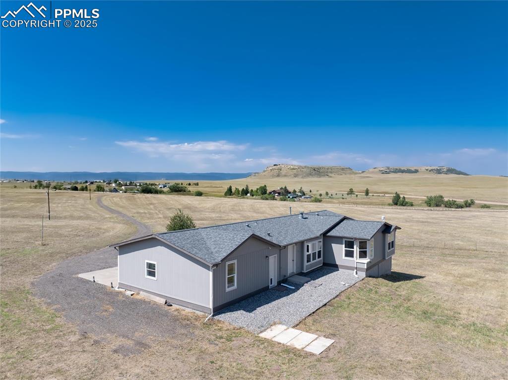 11100 Haskel Creek Road Larkspur, CO 80118 - Photo 9 of 49 a view of a terrace with a lake