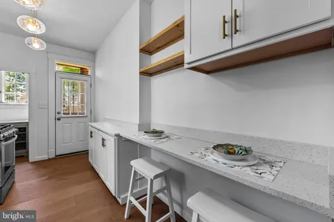 a kitchen with a stove and a microwave