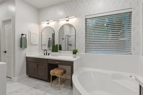 a bathroom with a granite countertop sink toilet and a mirror