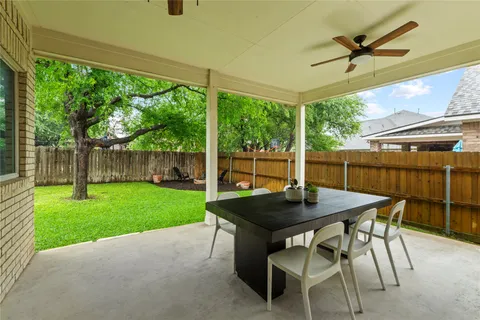 a view of a house with garden and patio