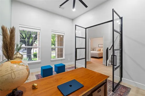 a living room with furniture and a view of kitchen