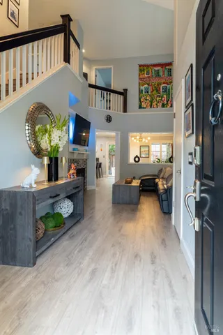 a view of living room kitchen with furniture and a fireplace
