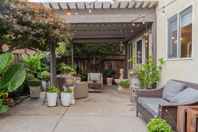 a vase of flowers sitting on a floor