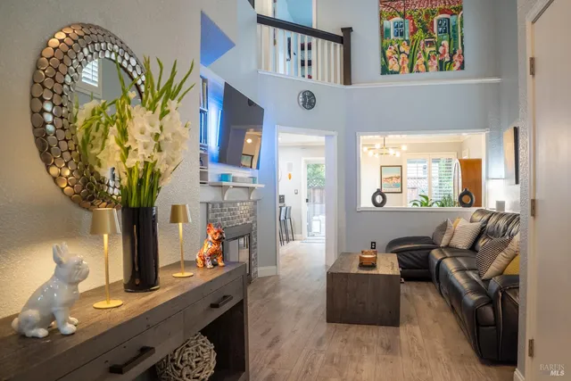 a living room with furniture and a potted plant