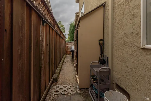a front view of a house with potted plants