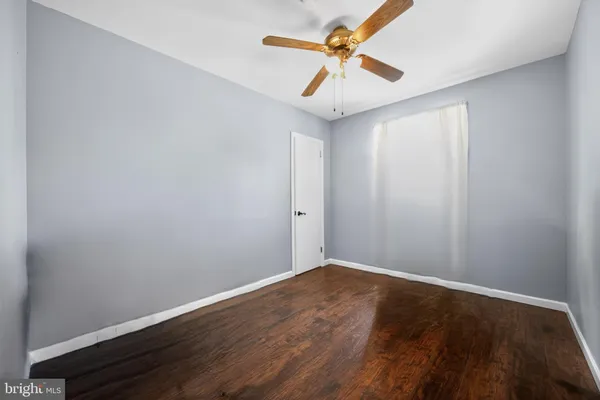 a living room with furniture and flat screen tv