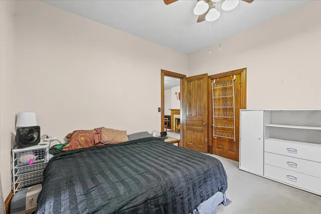 a bedroom with a bed and a cabinets