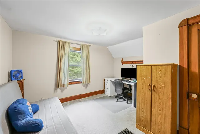a view of living room with furniture and a window