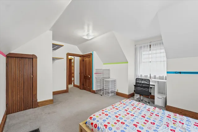 a bedroom with furniture and a window