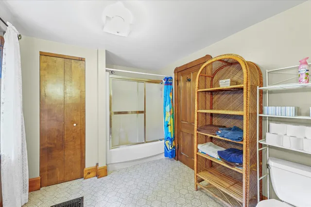 a room with a sink storage and utility