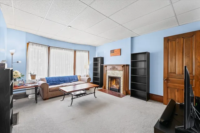 a living room with furniture and a fireplace