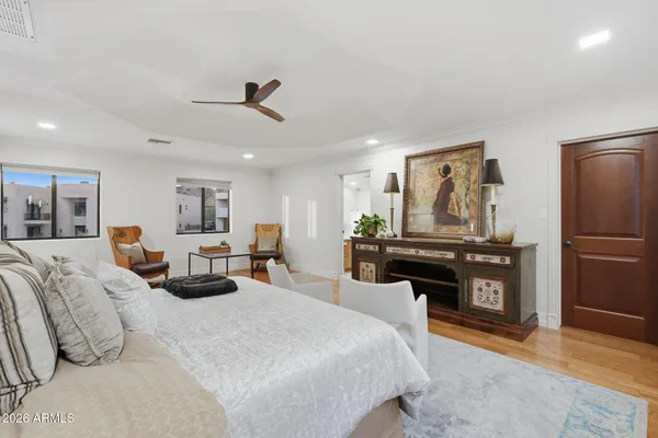 a white bath tub sitting next to a white toilet and a sink