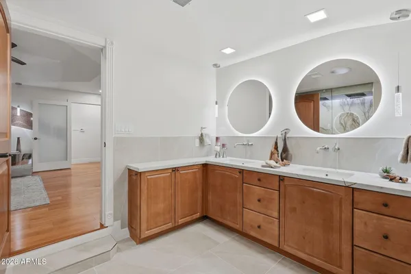 a white tub sitting next to a shower curtain