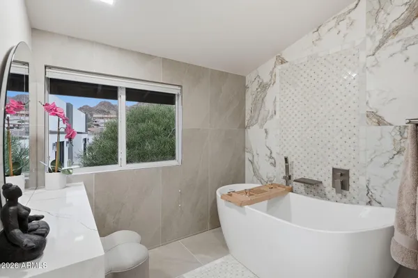 a bathroom with a sink mirror and vanity