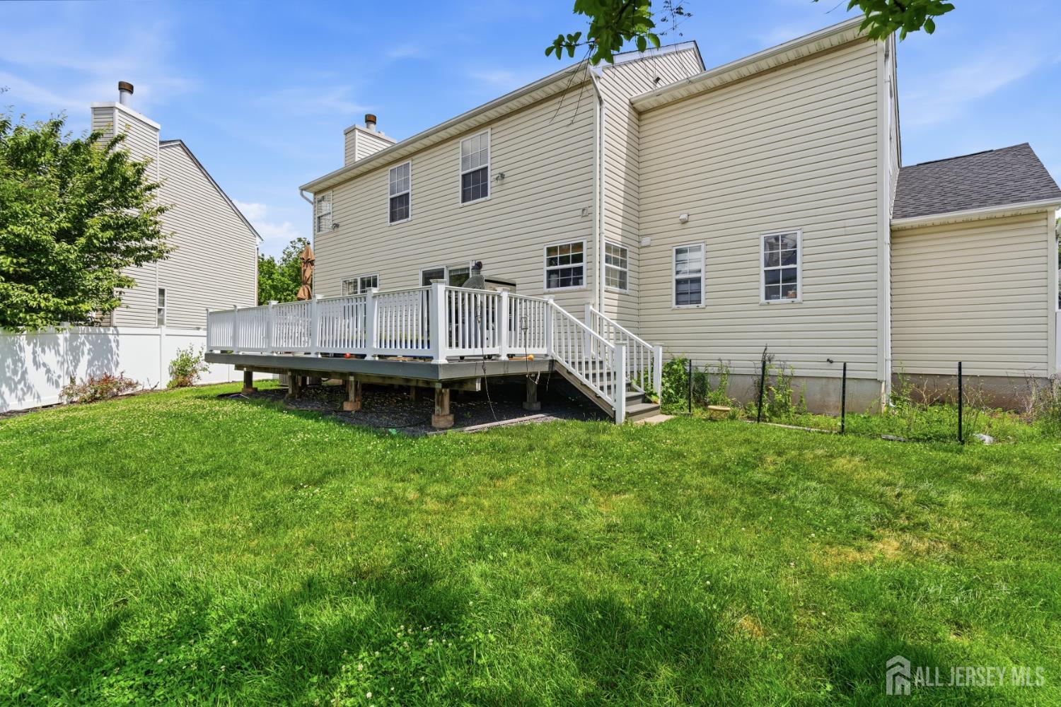 26 Alexis Lane Edison, NJ 08820 - Photo 35 of 39 a view of a house with a backyard and sitting area
