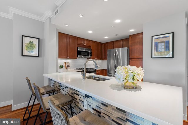 a kitchen with a table and chairs